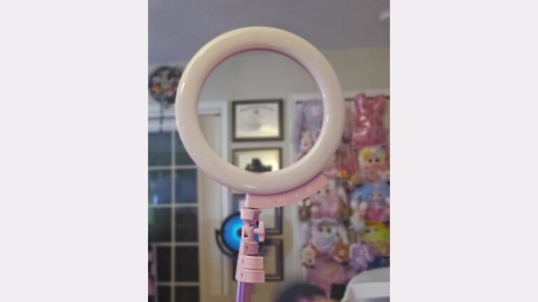 Dr. Elena’s pink UBeesize ring light with touch controls and an adjustable pink tripod joint, shown in her original footage