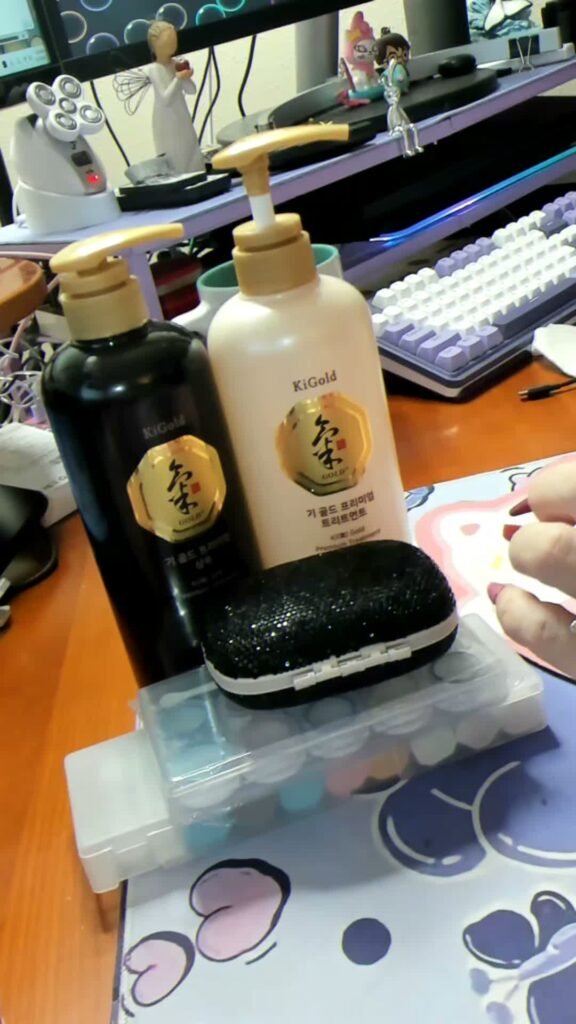Dr. Elena’s Ki Gold shampoo and treatment bottles on her desk.